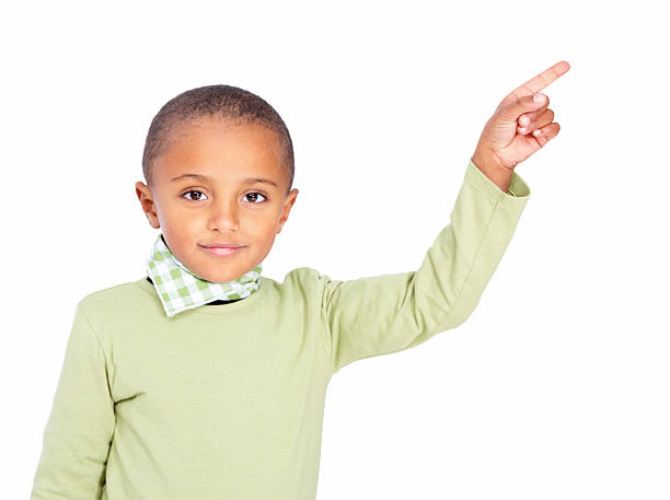 istock Innocent, sweet boy in green pointing towards blank space 183317312