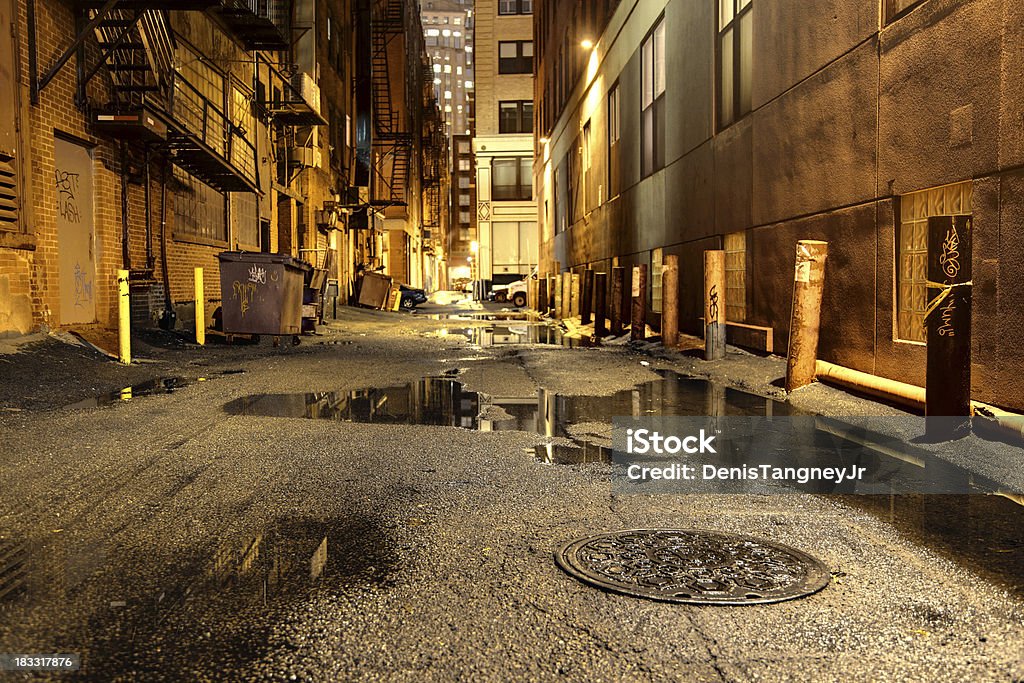 Dark Urban Road Dark alleyway in the City of Boston, shallow depth of field. Alley Stock Photo