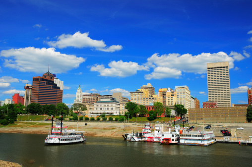 Memphis downtown skyline with Wolf River and historic steamboats in the foreground.