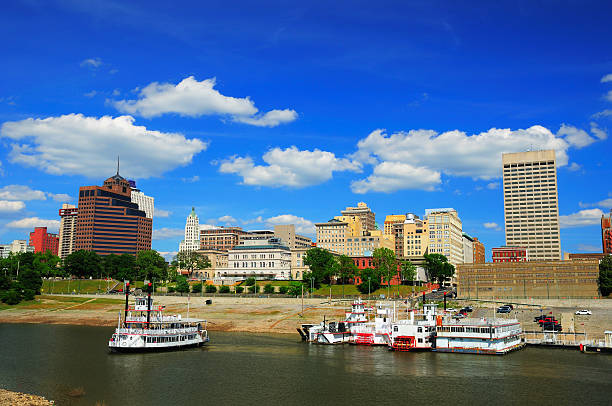 Memphis skyline and river Memphis downtown skyline with Wolf River and historic steamboats in the foreground. memphis tennessee stock pictures, royalty-free photos & images