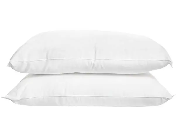 Pair of white pillows isolated on white background