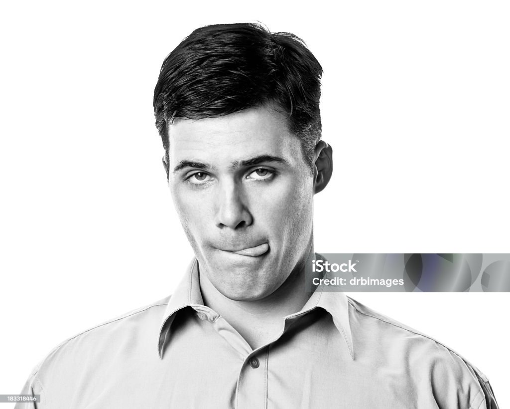 Young Male Portrait Black and white portrait of a young man on a white background.http://s3.amazonaws.com/drbimages/m/dordar.jpg Licking Lips Stock Photo