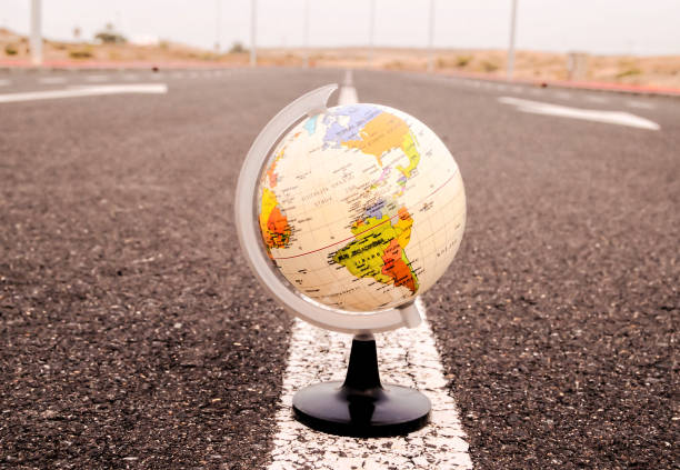istock Globe Earth on an Asphalt Street 1833185108