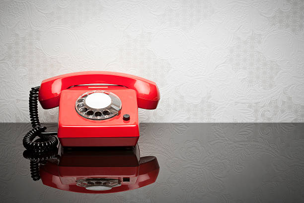 Red retro telephone on the desk