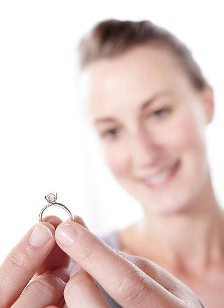 istock Girl admiring engagement ring 183318919