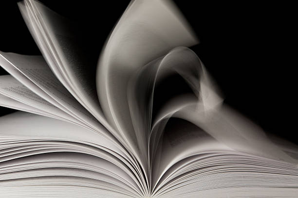 Opened book on black background