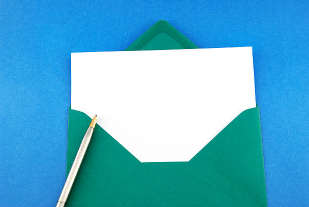 istock Green envelope with greeting card and pen 183319172