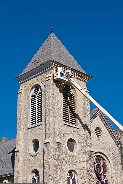 istock painting the church bell tower 183319199