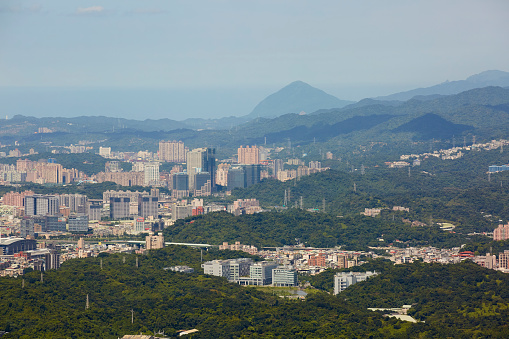 Top down aerial view of Taipei city, Taiwan. Building Exterior, Downtown District, cars, motorcycles, streets.