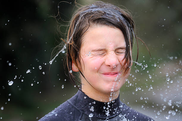 istock Young girl shaking her wet head 183319852