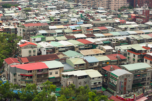 Top down aerial view of Taipei city, Taiwan. Building Exterior, Downtown District, cars, motorcycles, streets.