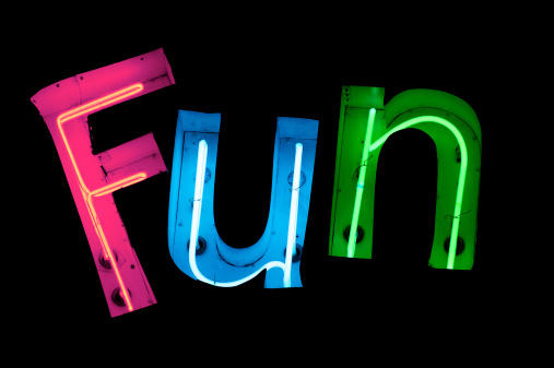 The word Fun spelled out in bright colorful neon lettering