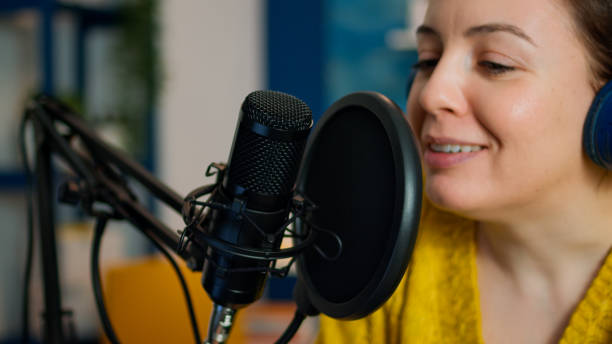 istock Creative influencer with headphones speaking during livestreaming 1833202561