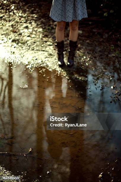 Autumn Puddle And Boots Stock Photo - Download Image Now - Adolescence, Adult, Autumn