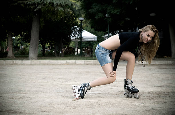 istock Young beautiful woman with roller skates 183320503