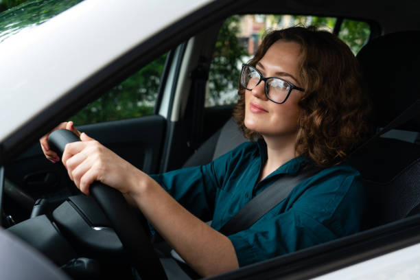 istock Woman driver is sitting in the car. 1833205264