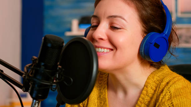istock Famous vlogger making an online podcast recording for virtual show 1833209525