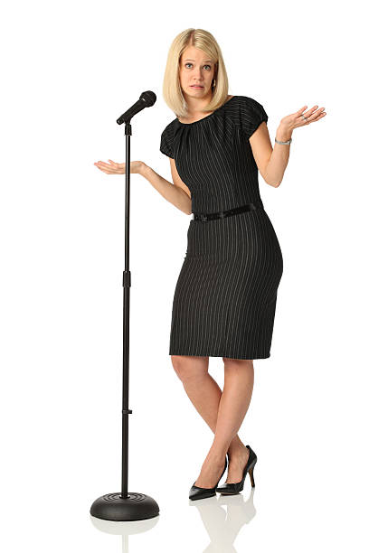 Nervous businesswoman at microphone Nervous businesswoman at microphonehttp://www.twodozendesign.info/i/1.png microphone stand photos stock pictures, royalty-free photos & images