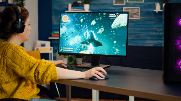 istock Gamer compete in a video game playing on a championship event 1833211633