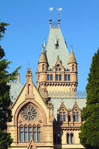 Castle Drachenburg half on top of Drachenfels at riverside of Rhine near KAnigswinter. Built between 1882 - 1884 as manor house of Baron Stephan von Sarter but never lived there. It is built in historistical style and today used as museum. Drachenfels is famous place of myths and on its top is also ruin of castle of medieval times.