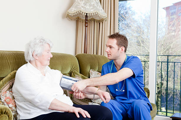 istock Nurse checking senior ladys blood pressure 183321355