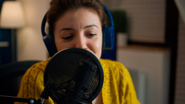 istock Influencer talking on professional microphone recording vlog 1833217967
