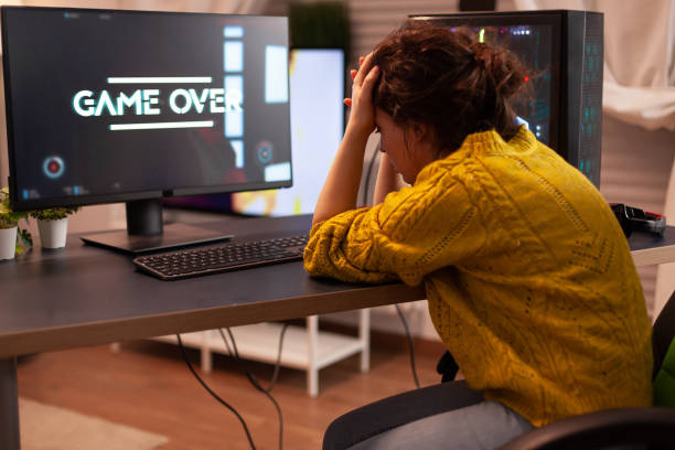 istock Angry pro gamer while playing shooter games beacuse she losing 1833219014
