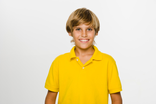 Portrait of boy with yellow shirt smiling