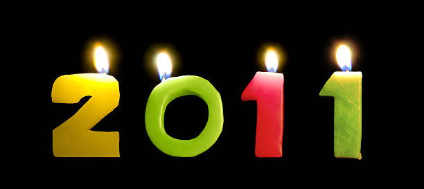 istock New year 2010 candles on black background 183322372
