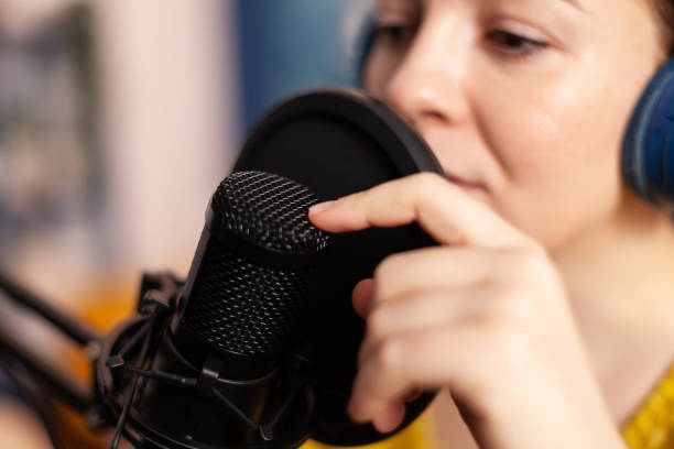 istock Influencer talking on professional microphone recording vlog 1833226893