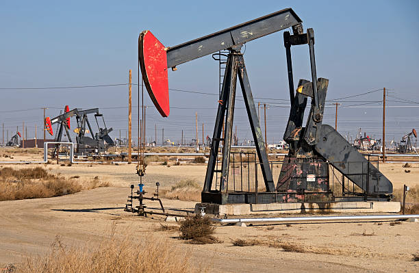 istock Pump jacks in oil field 183322993