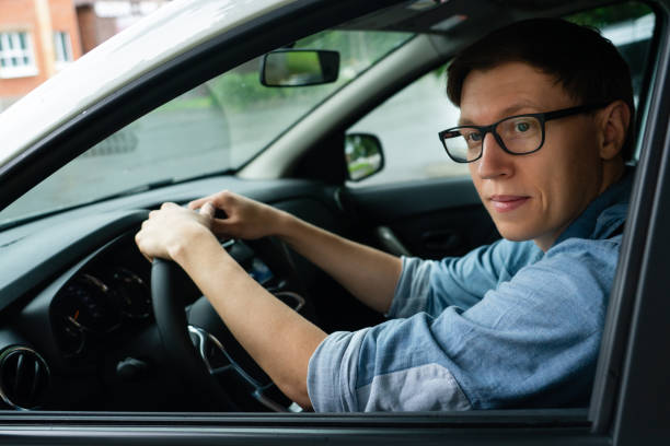 istock Male driver is sitting in the car. 1833230322