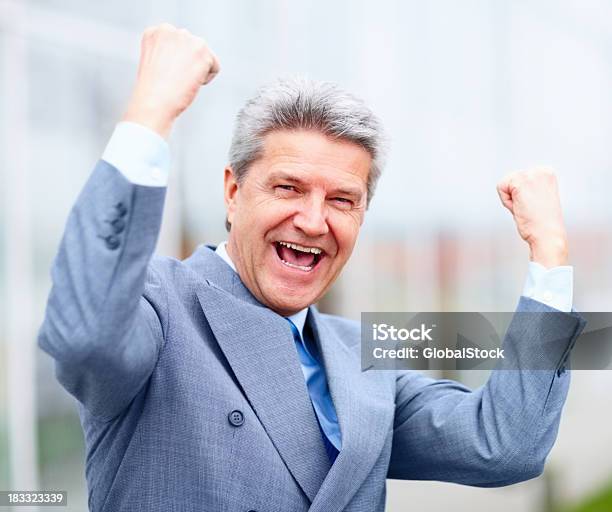 Happy Energetic Businessman Enjoying His Success Stock Photo - Download Image Now - Businessman, Celebration, Mature Adult
