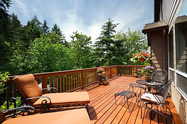 Sunny back deck with outdoor furniture.