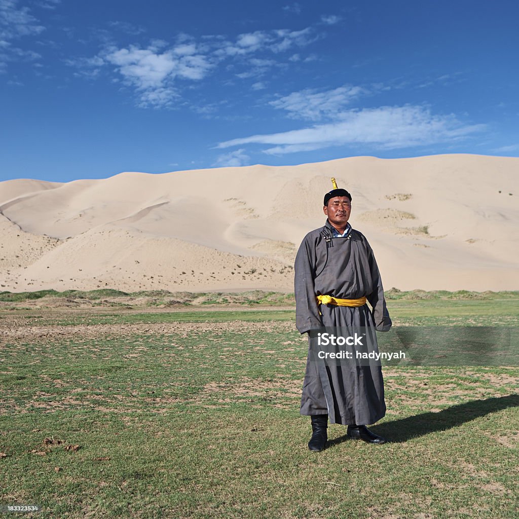 Mongolian wrestler Mongolian wrestler standing on the grass, sand dunes on the background.http://bem.2be.pl/IS/mongolia_380.jpg Active Lifestyle Stock Photo