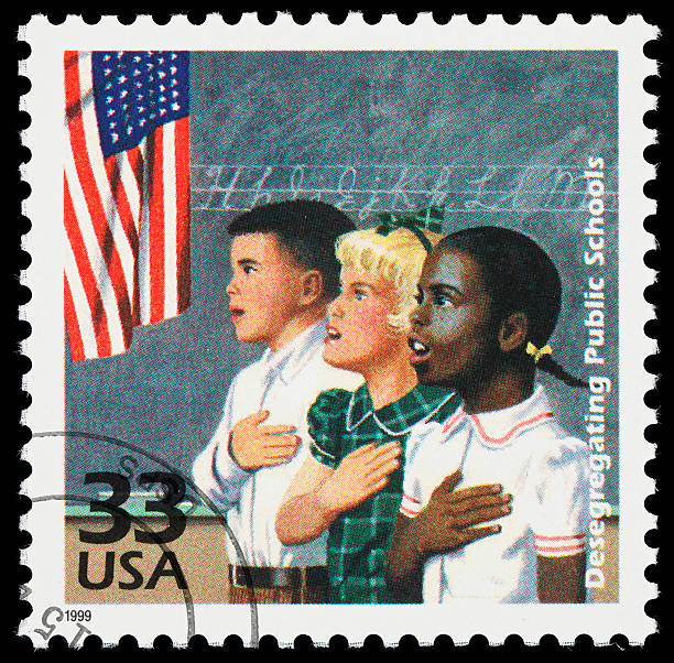 School desegregation postage stamp United States postage stamp marking the integration of the public school system in the 1950s. black civil rights stock pictures, royalty-free photos & images