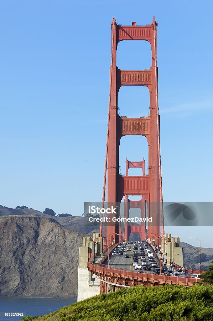 Scenic view of Golden Gate Bridge towers with busy traffic. "Golden Gate Bridge from San Francisco side of BayTaken in San Francisco, California, USA.Please view related images below or click on the banner lightbox links to view additional images, from related categories." Bridge - Built Structure Stock Photo