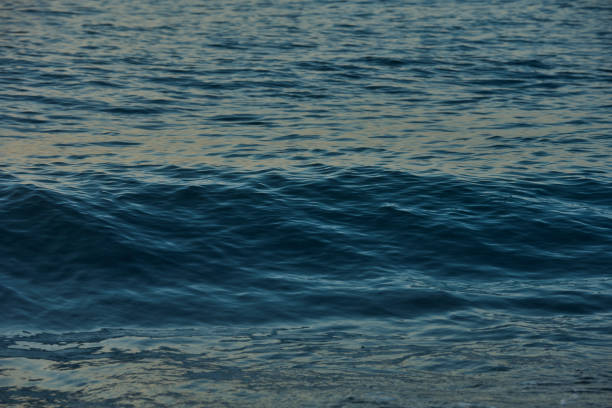 White sea wave splash water. Pacific Ocean with blue color. Blue water wave abstract pure natural texture, gel soap, background. Surface of water.