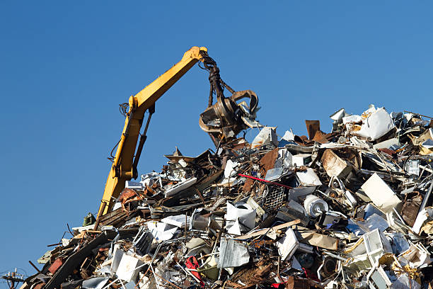 istock Metal Recycling Junkyard, Blue Sky, With Crane Lifting Trash 183324381