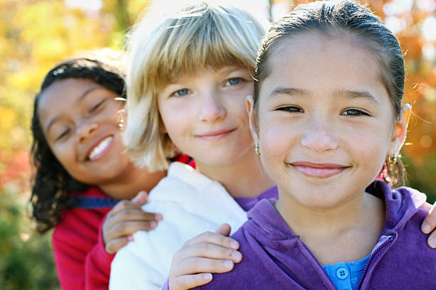 istock Three girls in the park. 183324475