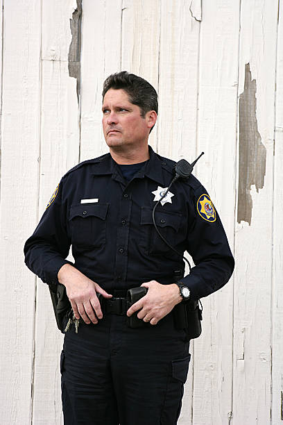 istock Police Officer Looking Away Vertical 183324568