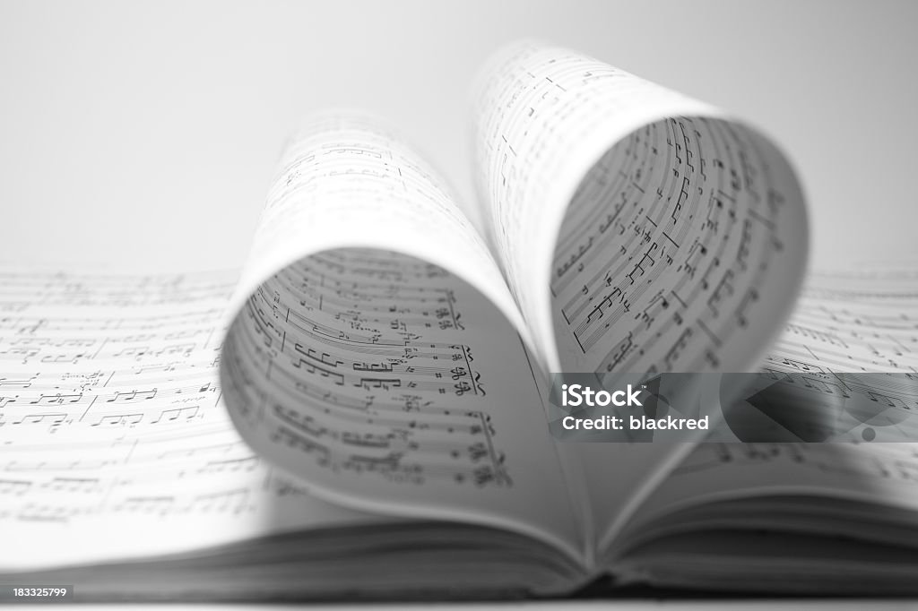 Music Love Sheet music bending into a heart shape. Music Stock Photo