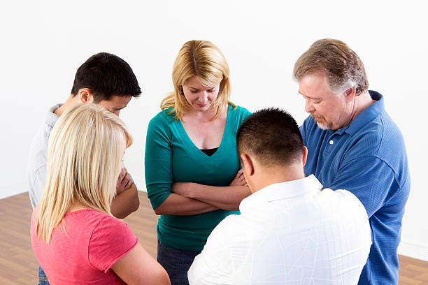Group Prayer Group of multi-ethnic people praying together. mormon woman photos stock pictures, royalty-free photos & images