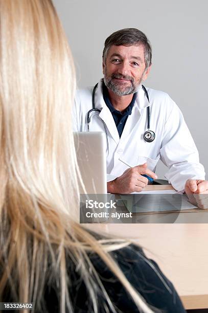 Smiling Medical Professional Doctor Stock Photo - Download Image Now - 40-49 Years, 50-54 Years, 50-59 Years