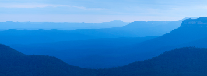 Beautiful layers of mountains. Photographed in the (appropriately titled) Blue Mountains in New South Wales, Australia. A seamlessly stitched panoramic image with a total size of 43 megapixels.