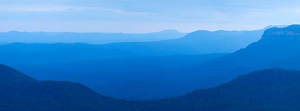 Layers of mountains at dusk, Blue Mountains, NSW, Australia Beautiful layers of mountains. Photographed in the (appropriately titled) Blue Mountains in New South Wales, Australia. A seamlessly stitched panoramic image with a total size of 43 megapixels. blue mountains australia photos stock pictures, royalty-free photos & images