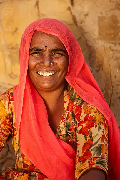 Indian woman sitting in front of her hut, Rajasthan, Thar desert. India.http://bem.2be.pl/IS/rajasthan_380.jpg