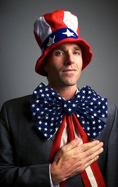 istock Patriotic American Puts Hand on Heart 183327326