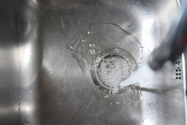 istock Water dripping from faucet tap at kitchen. Closeup 1833275257
