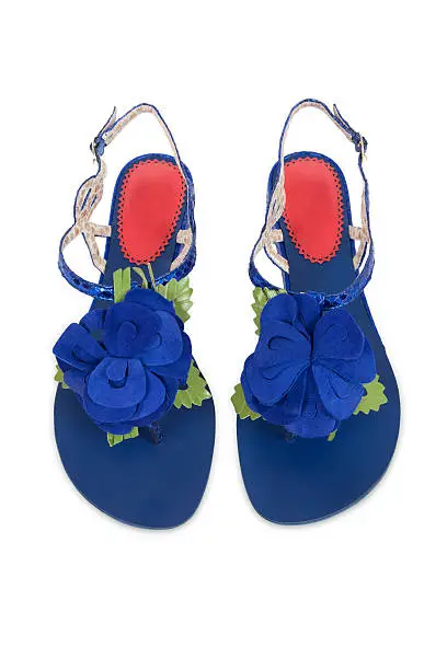 Blue suede sandles with butterfly decoration with leather leaves. Fashionable summer footwear.Related Images: